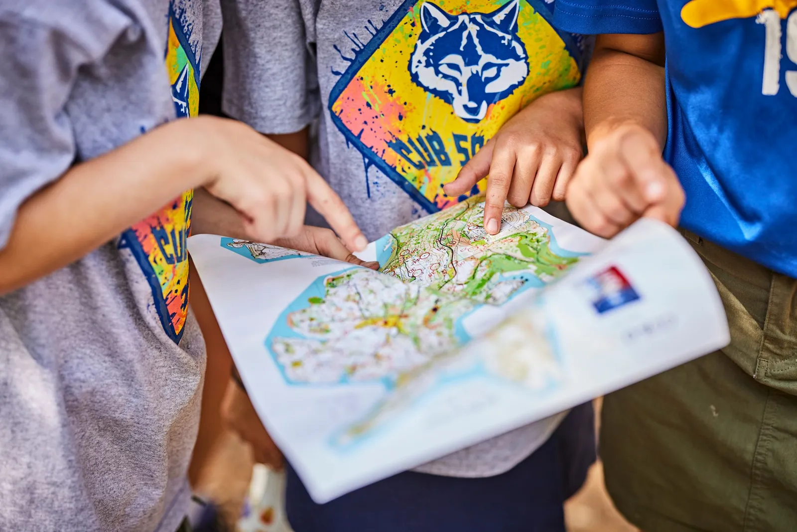 Cub Scouts studying a trail map together